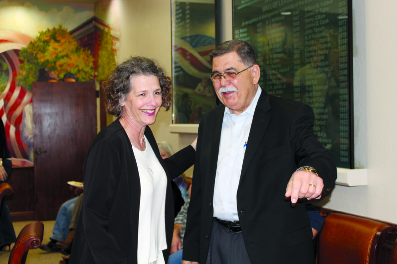  Mike Dumas laughs with Melissa Jerry at his retirement party Friday at the El Dorado-Union County Chamber of Commerce.
