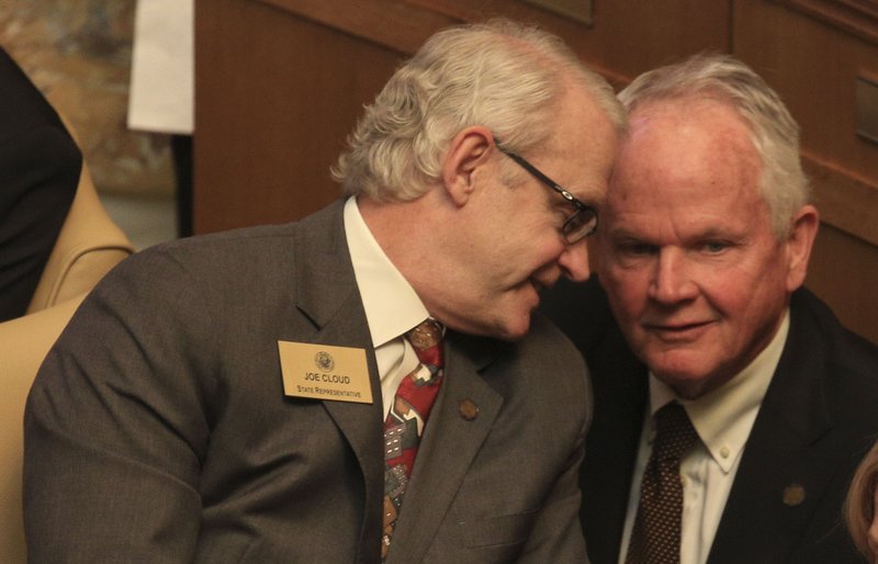 Rep. Joe Cloud (left), R-Russellville, is shown speaking with Rep. Stephen Magi, D-Conway.