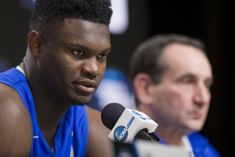 Duke forward Zion Williamson speaks, accompanied by head coach Mike Krzyzewski, during an NCAA men's college basketball news conference in Washington, Saturday, March 30, 2019. Duke plays Michigan State in the East Regional final game on Sunday. (AP Photo/Alex Brandon)