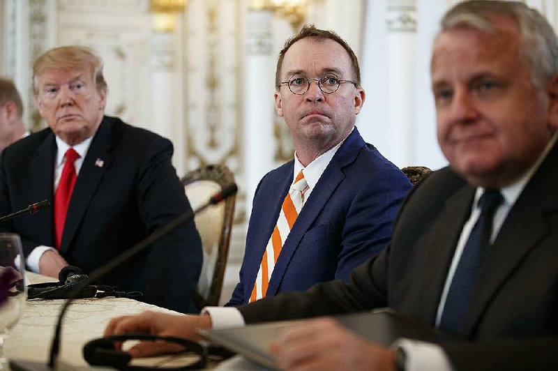 From left, President Donald Trump and acting White House chief of staff Mick Mulvaney, and Deputy Secretary of State John Sullivan, sit together during a meeting with Caribbean leaders at Mar-A Lago, Friday, March 22, 2019, in Palm Beach, Fla.