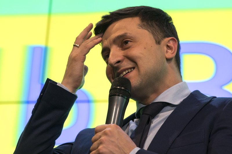 Ukrainian comedian Volodymyr Zelenskiy, reacts as he responds to a journalist question during a press conference, after the presidential elections in Kiev, Ukraine, Sunday, March. 31, 2019. Exit polls indicated Zelenskiy would get about 30 percent of the vote, far short of the absolute majority needed to win the first round. Most exit polls said incumbent Petro Poroshenko received the second-biggest support, which would put him and Zelenskiy in a runoff on April 21. (AP Photo/Emilio Morenatti)