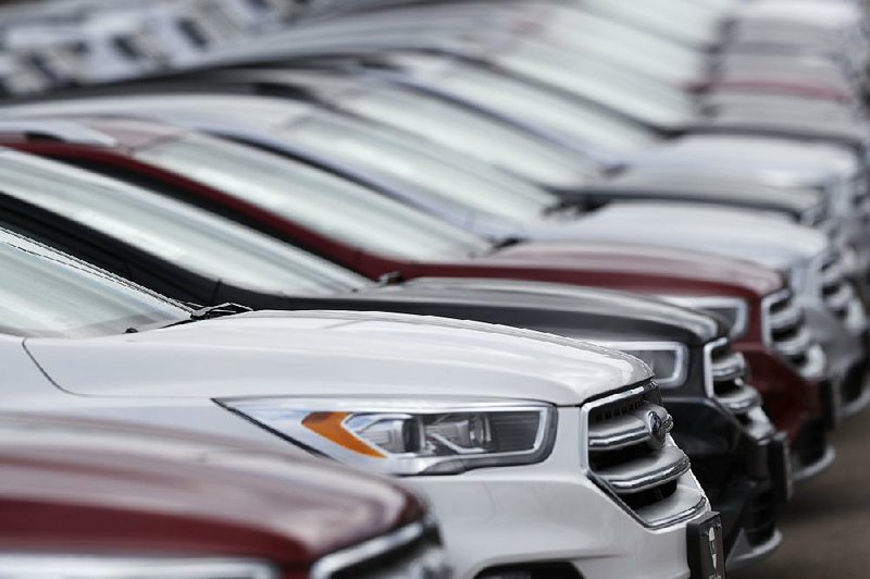 Escape sport utility vehicles are lined up in February at a Ford dealership in Broomfield, Colo. Orders for autos and auto parts fell 0.1 percent in February after a 0.5 percent decline in January. 