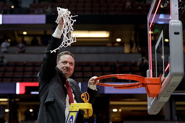 Texas Tech coach Chris Beard holds up the net after the team's win over Gonzaga in the West Regional final in the NCAA men's college basketball tournament Saturday, March 30, 2019, in Anaheim, Calif. Texas Tech won 75-69. (AP Photo/Marcio Jose Sanchez)