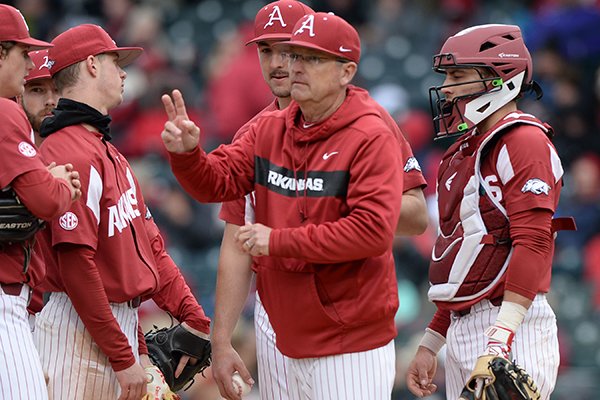 Arkansas coach Dave Van Horn motions toward the bullpen during a game against Ole Miss on Saturday, March 30, 2019, in Fayetteville. 