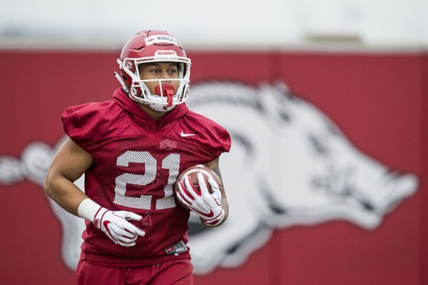 Arkansas running back Devwah Whaley goes through practice Friday, March 1, 2019, in Fayetteville.