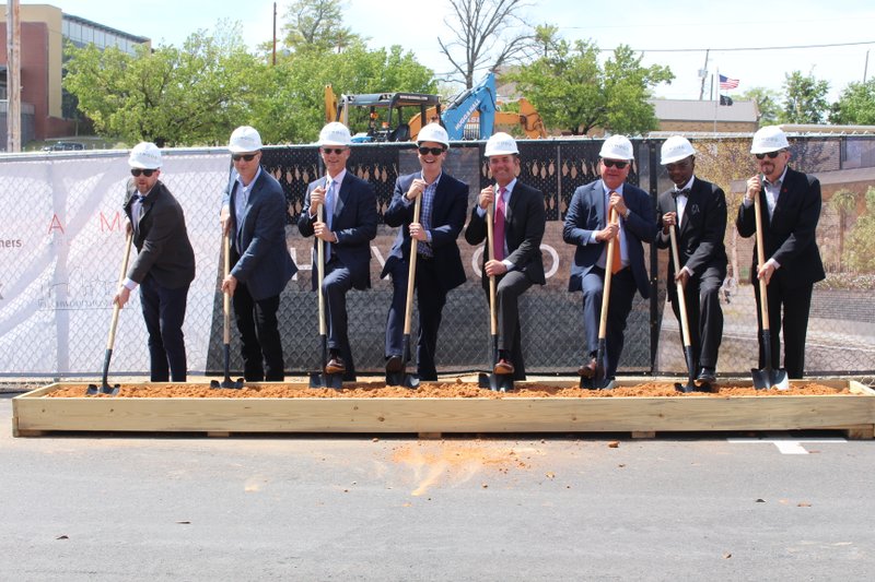 Breaking ground: Haywood stakeholders broke ground on the new Haywood hotel at a ceremony at the hotel’s future site Wednesday. From left: Jonathan Opitz (AMR Architects), Shannon Earls (Clark Contractors), Claiborne Deming (Murphy Oil), Jamie Moses (Newmark Moses Tucker), Ray Nolan (Newmark Moses Tucker), Madison Murphy (Murphy USA), Pierce Moore (office of El Dorado mayor) and Terry Stewart (Murphy Arts District). Caitlan Butler/News-Times