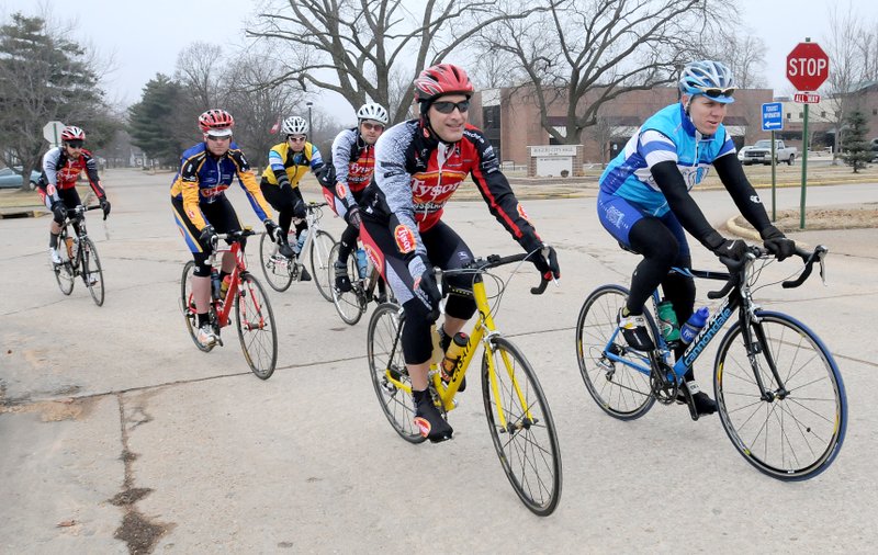 FILE — After a session on riding formation, safety and route planning led by Buster Brown, right, six bicyclists leave downtown Rogers on Sunday, Jan. 17, 2009.