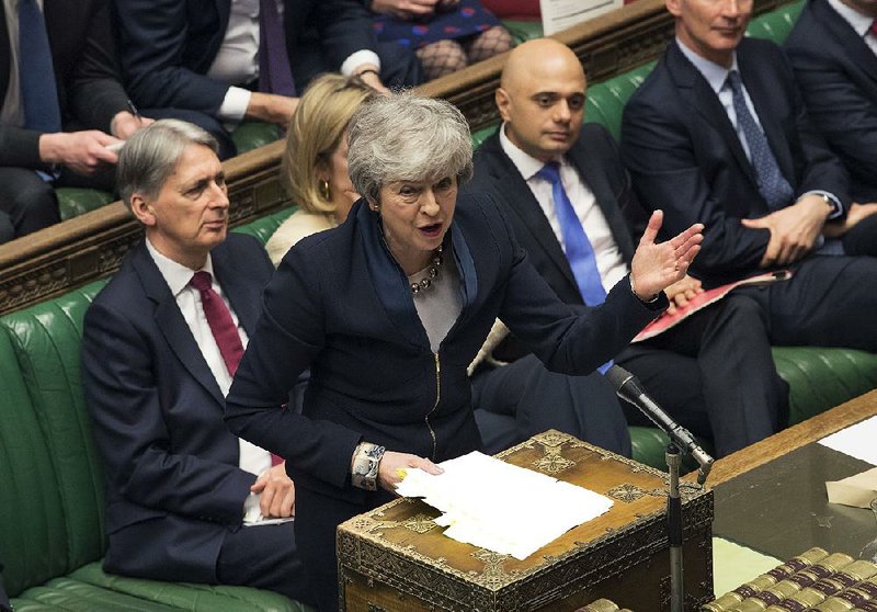Britain’s Prime Minister Theresa May addresses members of parliament Wednesday in the Palace of Westminster in London. 