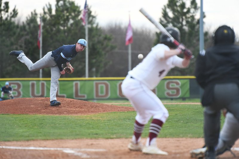 NWA Democrat-Gazette/J.T. WAMPLER Har-Ber's Blake Adams pitches to Springdale's Brock Pounders Monday April 1, 2019 at the Randal Tyson Recreational Complex in Springdale. Har-Ber won 4-3 in eight innings, then edged the Red Bulldogs 3-2 on Tuesday for their eighth consecutive win.