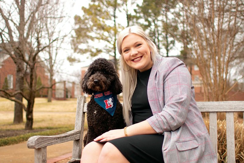 Hayley Cormican of Batesville poses with her dog, Sonny, on the Lyon College campus, where she has been elected Student Government Association president. Cormican, 20, grew up in Batesville and wants to implement programs to further integrate the city and college.