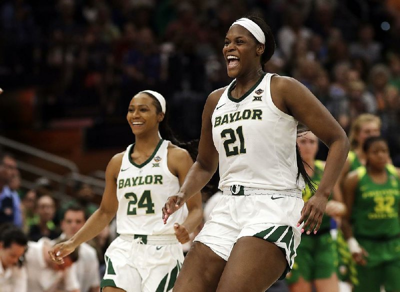 Baylor’s Kalani Brown (right) and Chloe Jackson celebrate after the Bears’ victory over Oregon on Friday night. The Bears advanced to Sunday’s final against Notre Dame.