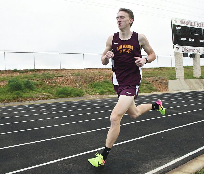 Submitted photo RECORD BREAKER: Lake Hamilton senior Colby Swecker makes his way around the track in the 1600-meter run Thursday at Nashville. Swecker broke the meet record in the event, which was set in 1967.
