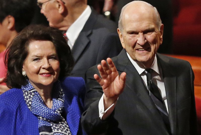 FILE - In this Oct. 6, 2018, file photo, President Russell M. Nelson and his wife, Wendy, wave as they leave the morning session of a twice-annual conference of The Church of Jesus Christ of Latter-day Saints in Salt Lake City. Nelson has generated buzz in his first year by becoming one of the most visible presidents in modern church history and implementing a number of changes. (AP Photo/Rick Bowmer, File)