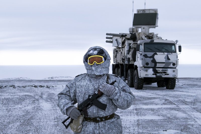 In this photo taken on Wednesday, April 3, 2019, a Russian solder stands guard as Pansyr-S1 air defense system on the Kotelny Island, part of the New Siberian Islands archipelago located between the Laptev Sea and the East Siberian Sea, Russia. Russia has made reaffirming its military presence in the Arctic the top priority amid an intensifying international rivalry over the region that is believed to hold up to one-quarter of the planet's undiscovered oil and gas. (AP Photo/Vladimir Isachenkov)