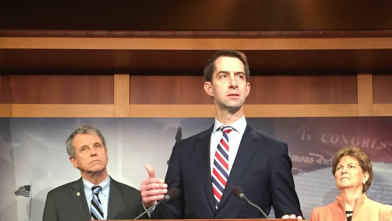 Sen. Tom Cotton (center), R-Ark., is shown with Sen. Sherrod Brown (left), and Sen. Jeanne Shaheen (right) at a press conference on Capitol Hill April 4, 2019.