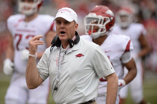 Arkansas coach Chad Morris speaks to members of his offense Saturday, April 6, 2019, during the Razorbacks' spring game in Razorback Stadium in Fayetteville.
