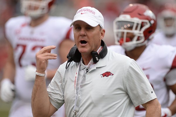 Arkansas coach Chad Morris speaks to members of his offense Saturday, April 6, 2019, during the Razorbacks' spring game in Razorback Stadium in Fayetteville.
