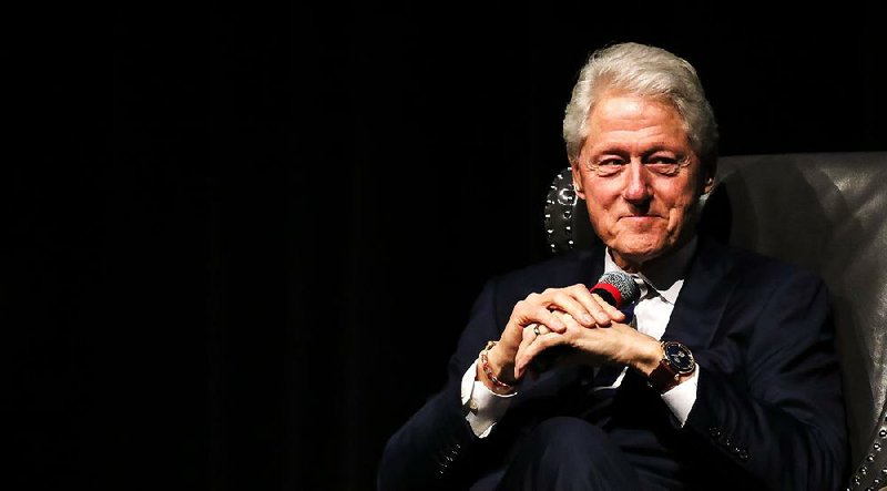 Former President Bill Clinton sits on stage as the keynote speaker for the Hope/Hempstead County Chamber of Commerce annual meeting and banquet on Saturday, April 6, 2019, in Hope, Arkansas.