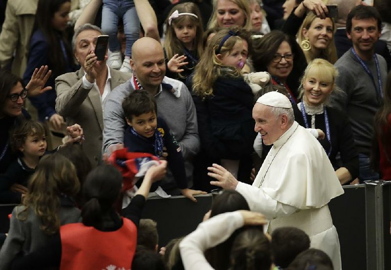 Pope Francis leaves the Paul VI hall at the Vatican on Saturday after sharing his criticism of Europe and the U.S. during an  audience with students and  teachers from Milan’s San Carlo  Institute. 