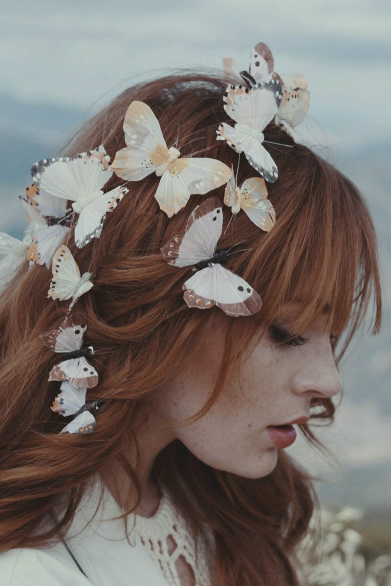 This May 2015 photo provided by Etsy seller Wild and Free Jewelry shows a model wearing Butterfly Clips, in Santa Barbara, Calif. From butterfly clips to polka dots, '90s trends have been making a fashion comeback. Now '90s babies are increasingly reaching average marrying age. So it's no surprise these trends are popping up all over the wedding industry too. (Wild and Free Jewelry/Etsy via AP)