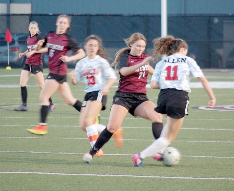 Graham Thomas/Siloam Sunday Siloam Springs senior Hailey Dorsey fights with Vilonia's Sarah Allen for possession of the ball during the first half Friday at Panther Stadium. The Lady Panthers defeated the Lady Eagles 6-2.