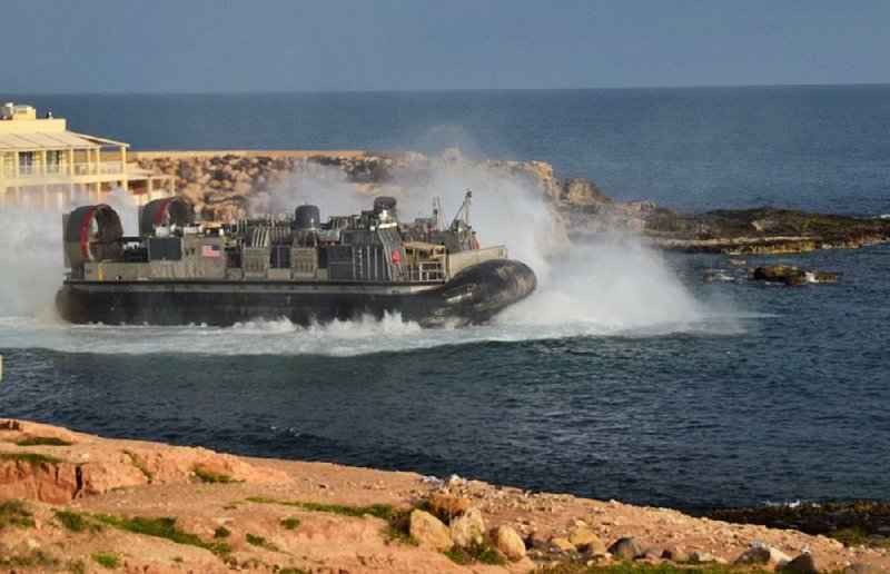 A U.S. transport craft ferries American forces away from Janzour, Libya, on Sunday.