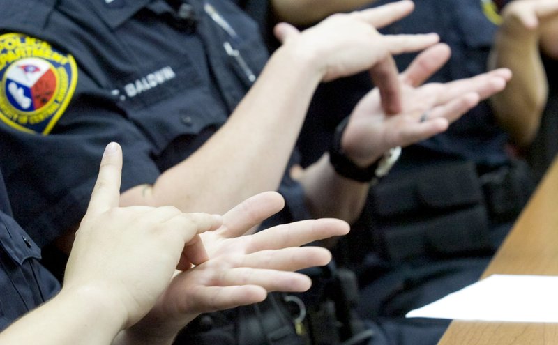 Members of the UCA Campus Police learn sign language in this photo taken in 2011. (Democrat-Gazette file photo)