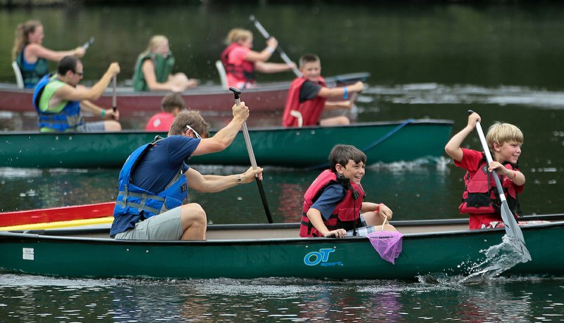 Children attending Camp Aldersgate's diabetes camp enjoy a boat race in 2014. (Democrat-Gazette file photo)