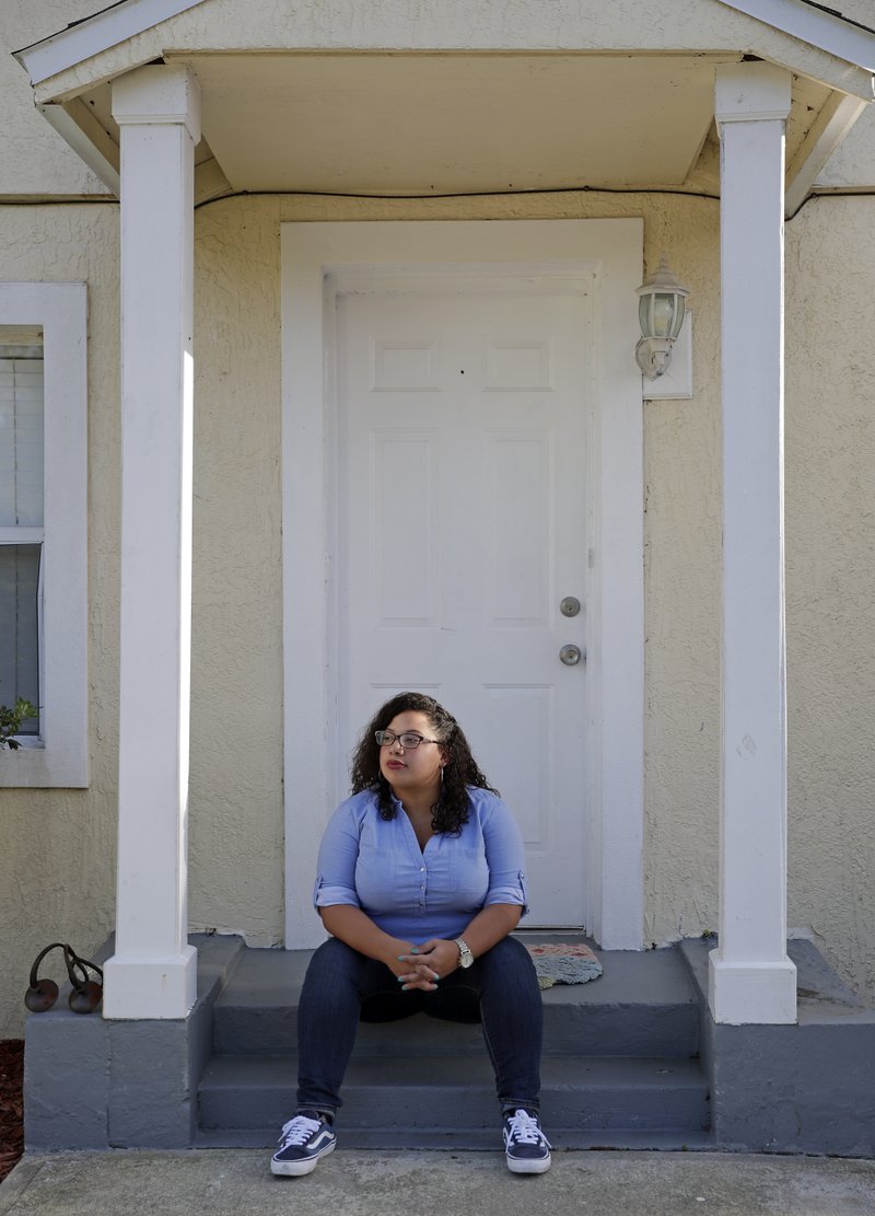 In this Thursday, March 28, 2019 photo Stephanie Loraine Pineiro reflects at her home in Orlando, Fla. When Loraine Pineiro was 17-years-old she was pregnant and wanted to have an abortion without her parents permission. Now 27, she works as a social worker and advocate for reproductive rights in Orlando. (AP Photo/John Raoux)