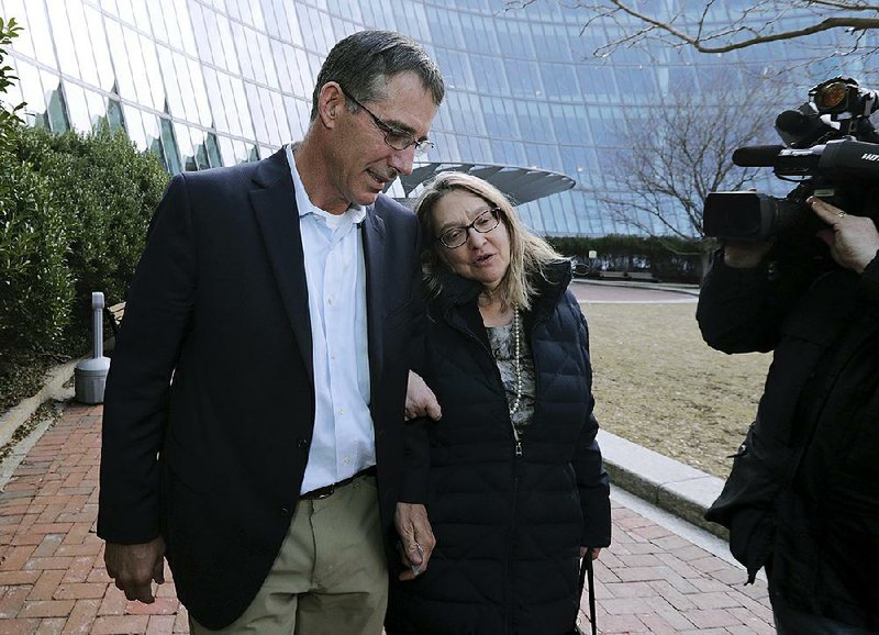 Michael Center, former tennis coach at the University of Texas at Austin, leaves a federal courthouse in Boston last month. Prosecutors said Monday that Center has agreed to plead guilty in the college-admissions scheme. 