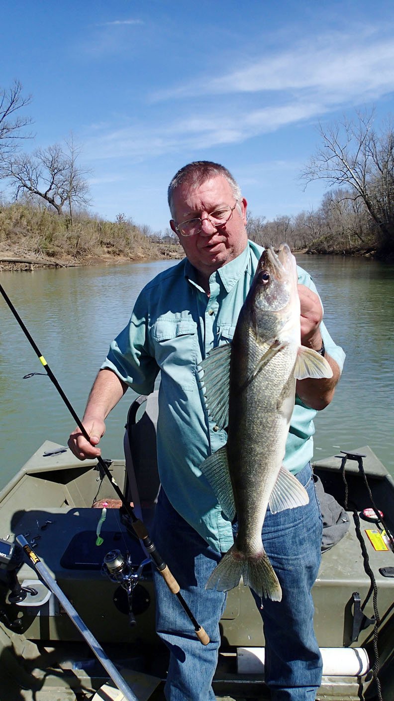 NWA Democrat-Gazette/FLIP PUTTHOFF Mike McBride used a single-tail grub to catch this 21-inch walleye in mid-March on the White River east of Fayetteville.