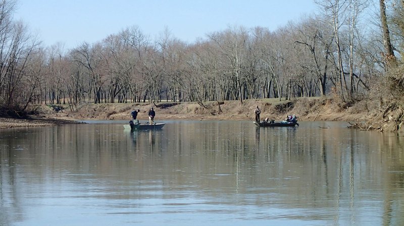 NWA Democrat-Gazette/FLIP PUTTHOFF Anglers fish mid-March on the White River east of Fayetteville.