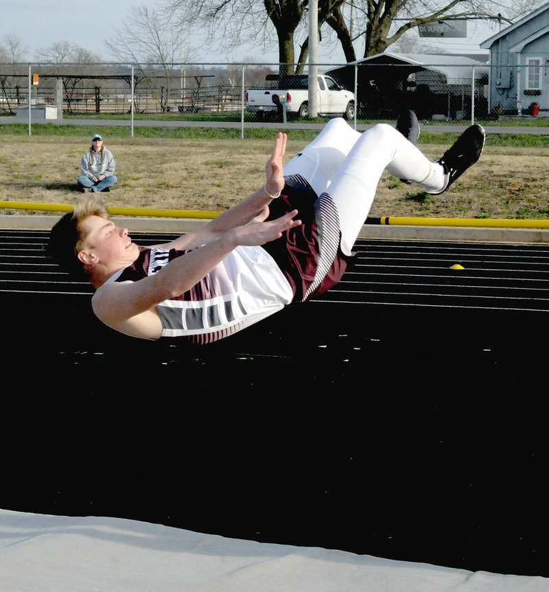 MARK HUMPHREY ENTERPRISE-LEADER/Gentry's Beau Tomblin clears the bar completing a high jump during the first-ever track and field meet hosted by Lincoln High School on Thursday. The Gentry boys won the meet with 146 points, while Gravette was second with 125. Tomblin placed second in high jump, reaching 5-08 while teammate Blake Wilkinson was third at 5-06.