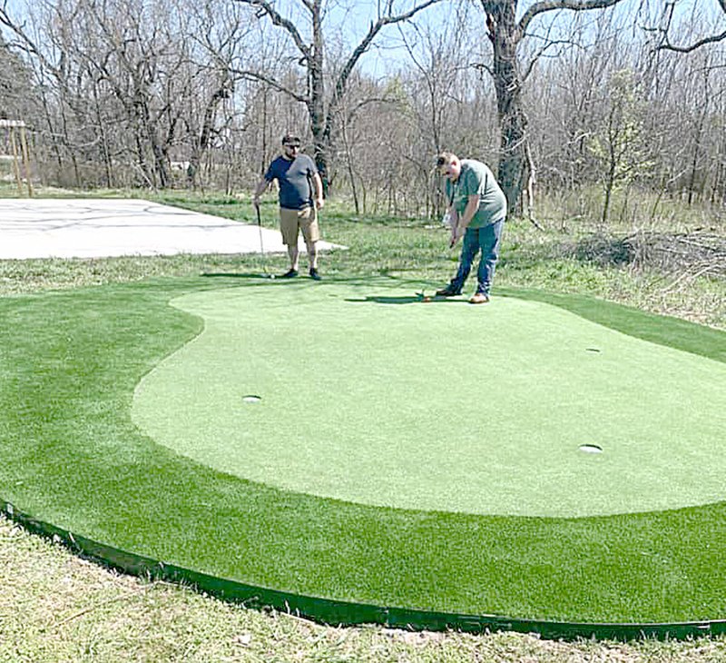 Photo submitted The Benton Country Boys and Girls Club is one of the beneficiaries of the Cooper Communities Northwest Arkansas Charity Classic, a golf tournament coming to the Country Club in June. Last year's proceeds helped fund this new putting green at the Bella Vista Unit.