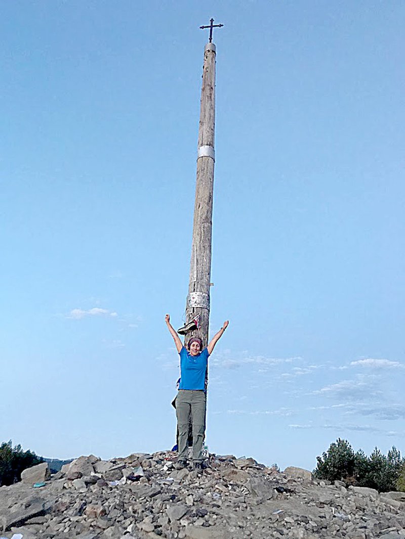 Photo submitted The La Cruz de Ferro, or Iron Cross, is at one of the highest points along the Camino de Santiago. Travelers leave a token representing a burden or problem behind.