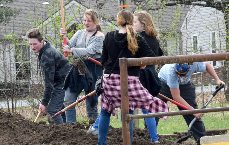 Westside Eagle Observer/MIKE ECKELS A small group of Decatur Middle and High School students works on spreading topsoil in its new community garden March 28. This group of FFA students is working towards planting and cultivating a garden of vegetables. Students working on the project include Sebastian Doyle, Elayah Bartlett, Nevaeh Flatt, Julie Bates and Curtis Lauber.