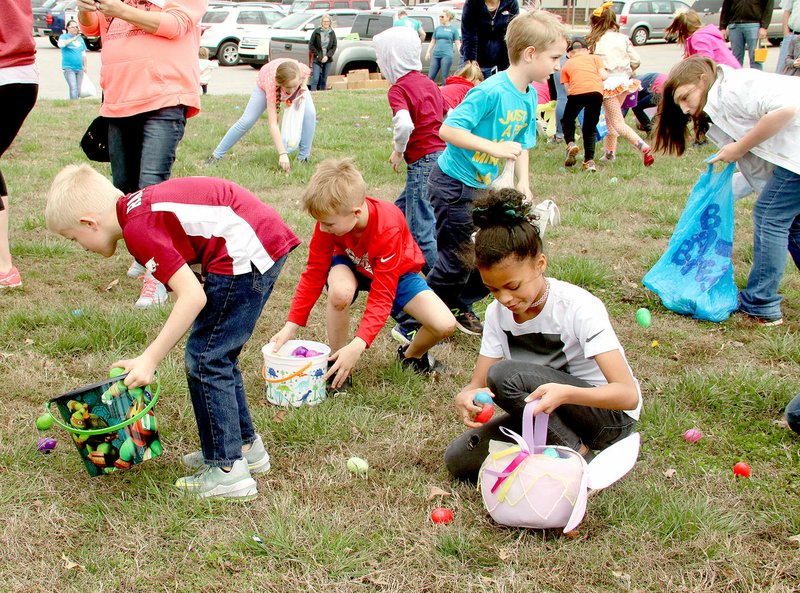 FILE PHOTO Children take off to pick up as many Easter eggs as they can at the 2018 Kiwanis Eggstravaganza at Williams Elementary School. This year's egg hunt will be Saturday afternoon.