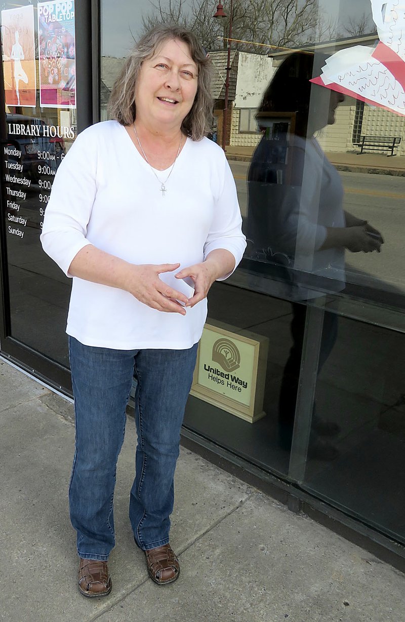 Westside Eagle Observer/RANDY MOLL Linda Crume was officially appointed as the interim librarian at Gentry Public Library last week. She is pictured in front of the Library on Friday.