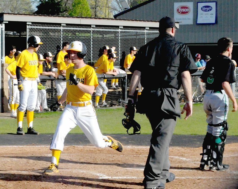 MARK HUMPHREY ENTERPRISE-LEADER Prairie Grove junior Tristan Smith scores on Jackson Sorters' sacrifice fly to tie the game 1-1. The Tigers rallied from a 1-0 deficit to defeat Greenland, 3-1, Friday in nonconference baseball action at Rieff Park.