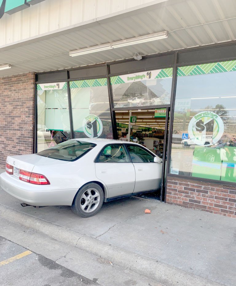 PHOTO COURTESY FARMINGTON PD This Lexus, driven by a 15-year-old girl, crashed into the front door of Dollar Tree on Saturday. No one was injured.
