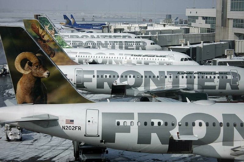 Frontier Airlines jets sit stacked up at gates along the A concourse at Denver International Airport in 2010.