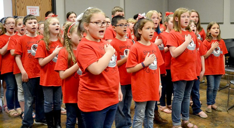TIMES photograph by Annette Beard The Pea Ridge Intermediate School select choir under the direction of Mrs. April Smith sang "The Star-Spangled Banner," the national anthem for the School Board Monday night.