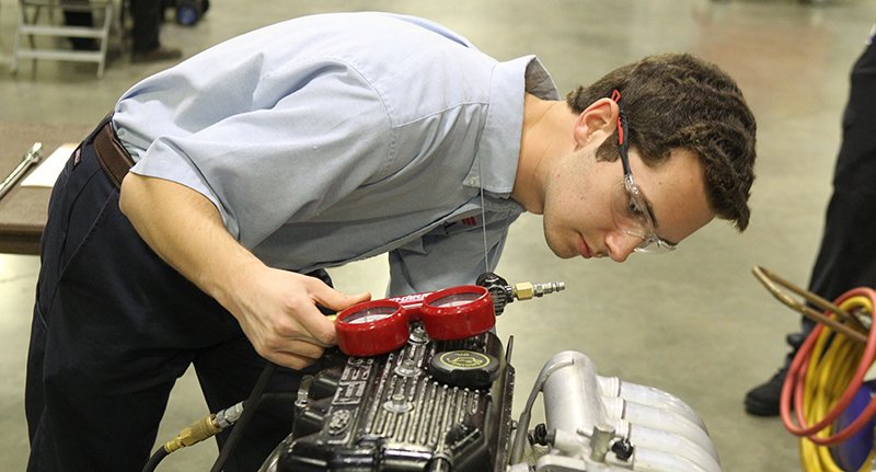 The Sentinel-Record/Richard Rasmussen COMPETITION: NPC student Andrew Tucker competes in automotive services technology during the Arkansas SkillsUSA State Competition at the Hot Springs Convention Center on Tuesday.