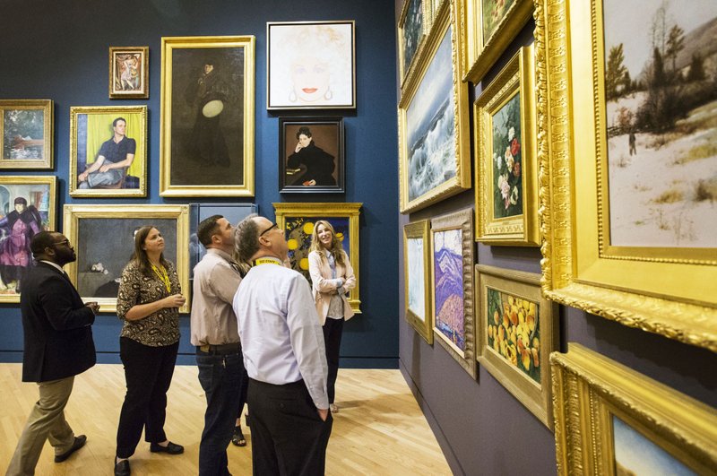 NWA Democrat-Gazette/BEN GOFF  @NWABENGOFF Dr. Nile Blunt (left), head of school programs at Crystal Bridges Museum of American Art, leads a tour Tuesday for the Springdale School Board and administrators at the Bentonville museum.