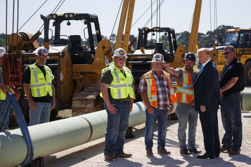 President Donald Trump takes a tour before speaking about energy and infrastructure at the International Union of Operating Engineers International Training and Education Center, Wednesday, April 10, 2019, in Crosby, Texas. (AP Photo/Evan Vucci)
