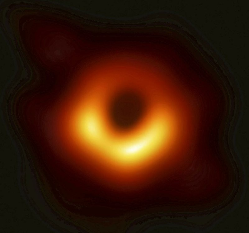 A black hole is shown for the first time in this composite image released Wednesday by a research team of 200 scientists from 20 countries. The image was pieced together from data gathered from eight radio telescopes around the world.