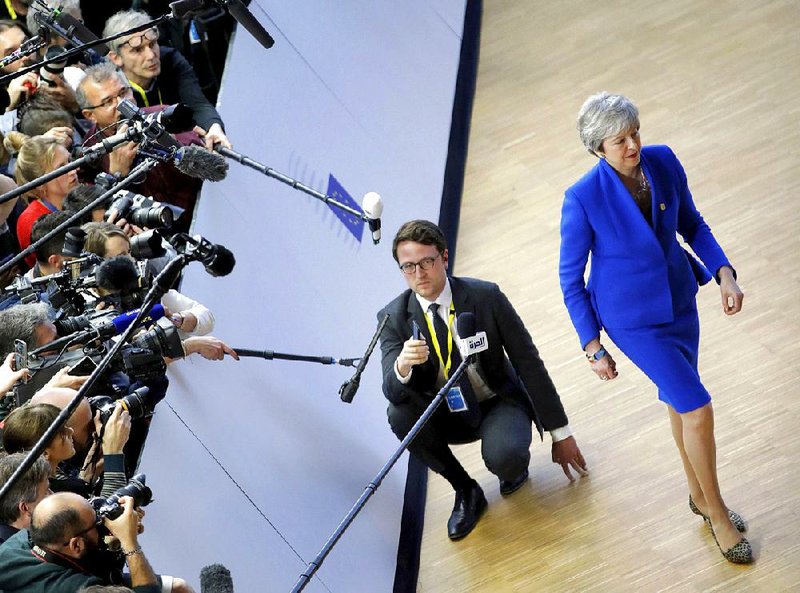 British Prime Minister Theresa May ends a session with the media Wednesday as she arrives in Brussels for an emergency European Union meeting on Britain’s exit from the EU, which was set to happen Friday. After meeting past midnight, the 27 remaining member states reportedly agreed to grant an extension until Oct. 31 after May pleaded for a delay. 