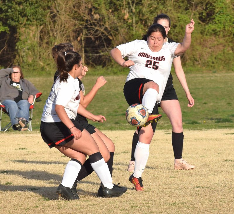 RICK PECK/SPECIAL TO MCDONALD COUNTY PRESS McDonald County's Esmerelda Estrada attempts to control a loose ball during the Lady Mustangs' 5-0 loss to Neosho on April 2 in Neosho.