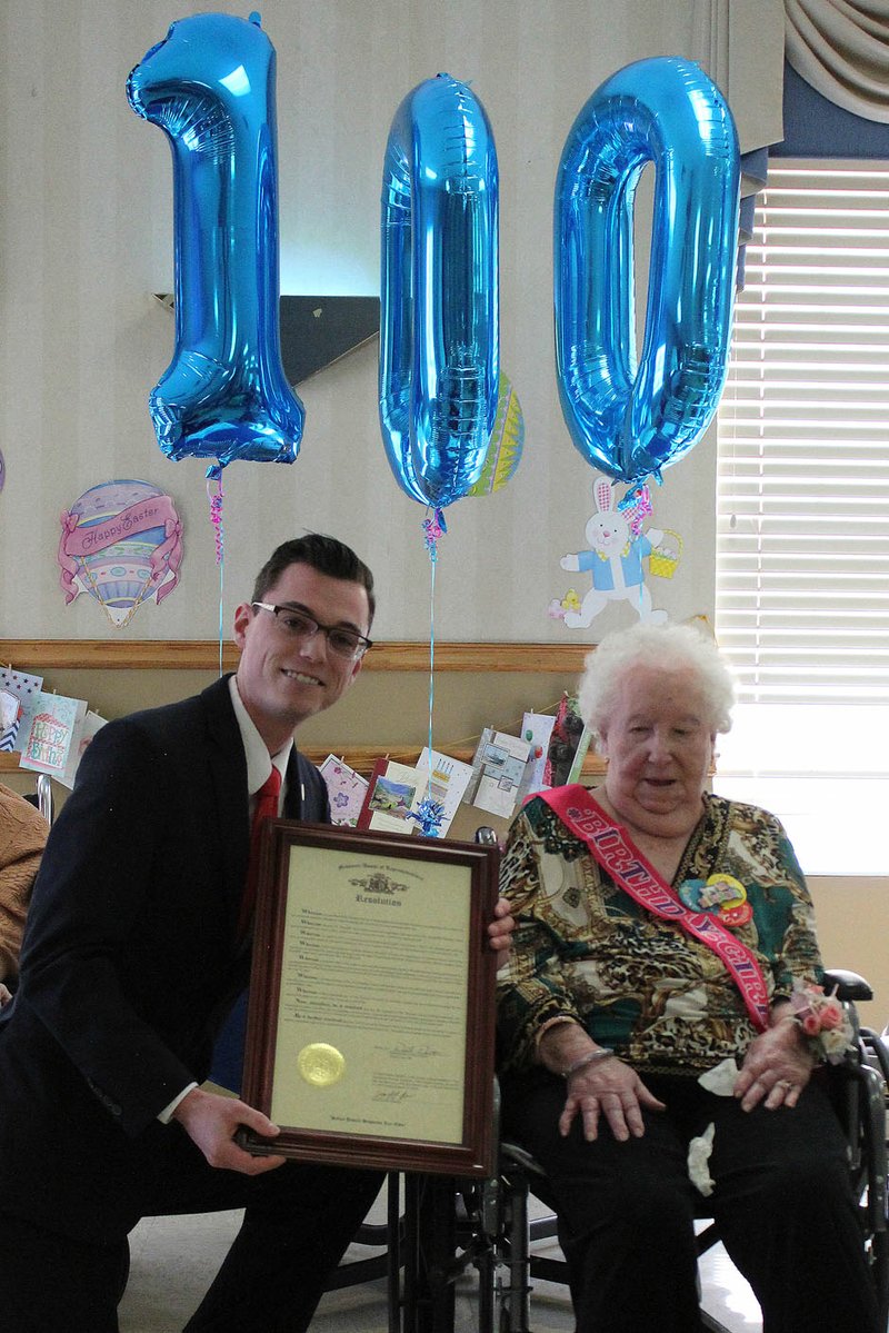 MEGAN DAVIS/MCDONALD COUNTY PRESS Bea Woodfill, an Anderson native, was surrounded by friends and family during her 100th birthday party at the McDonald County Living Center on Friday, April 5. State Representative Dirk Deaton was present to award her with a resolution from the Missouri House of Representatives, commending the many contributions she made to her community throughout her life.