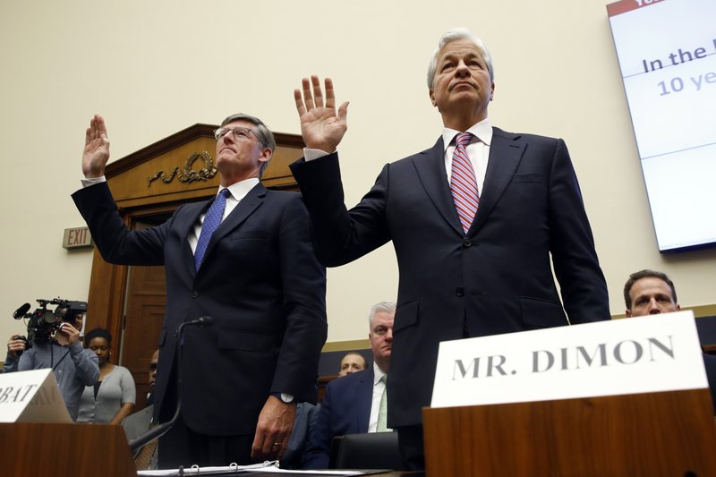 Citigroup CEO Michael Corbat, left, and JPMorgan Chase chairman and CEO Jamie Dimon are sworn in before testifying before the House Financial Services Committee during a hearing, Wednesday, April 10, 2019, on Capitol Hill in Washington. JPMorgan Chase reported that credit card sales were up 10% in the third quarter, and Citigroup reported a 5% rise.
 (AP Photo/Patrick Semansky)